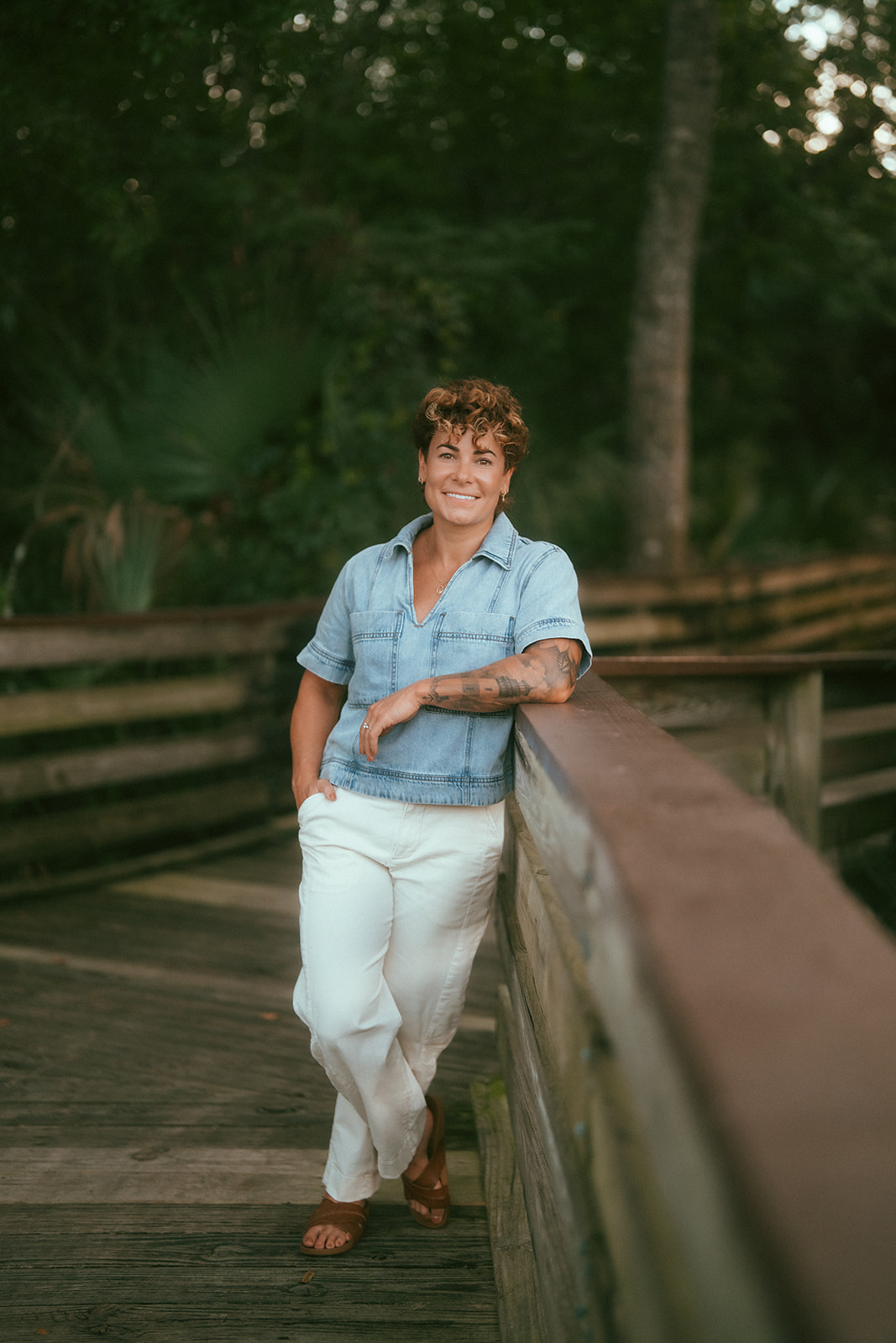 Brittany enjoying time outdoors on a wooded boardwalk